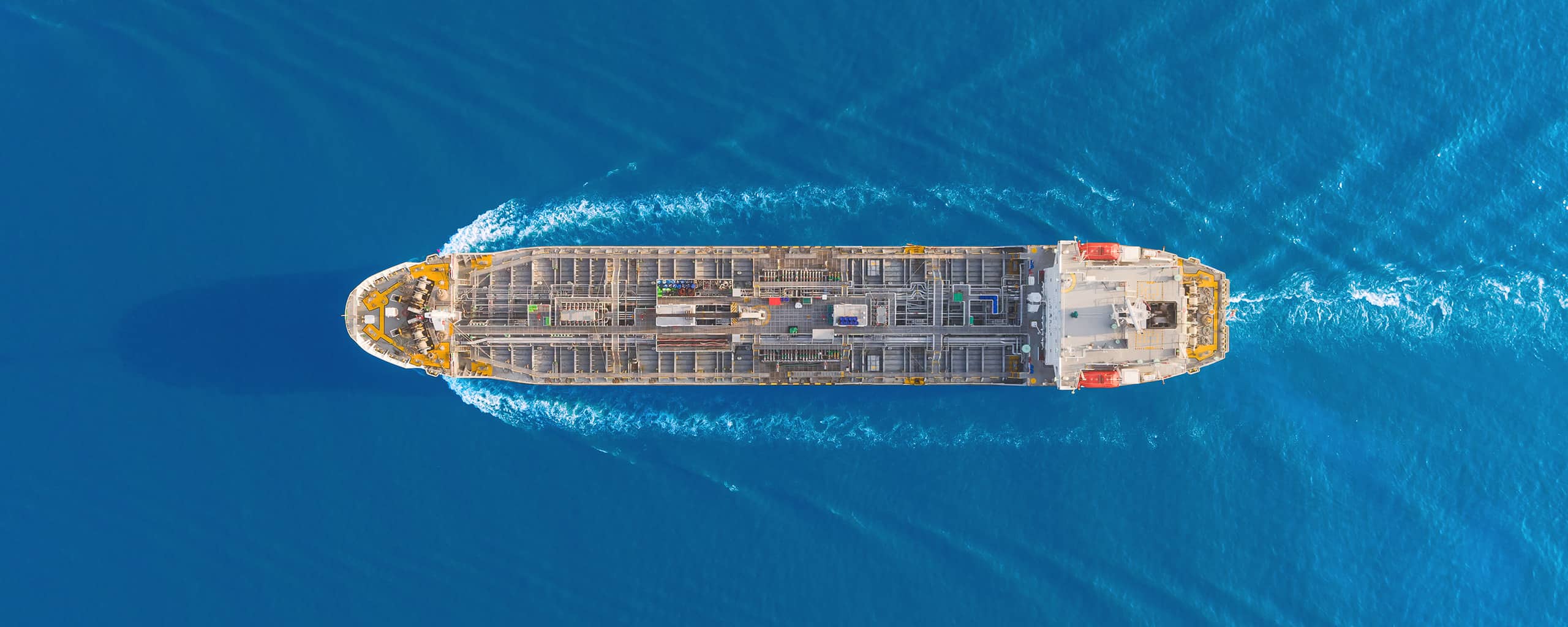 Aerial top view Oil ship tanker full speed for transportation oil from refinery on the sea.
